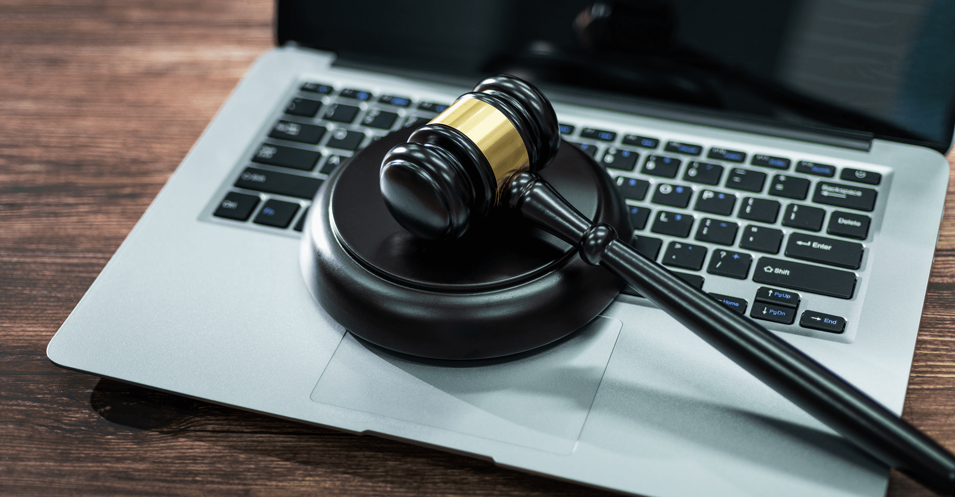 Gavel on laptop keyboard