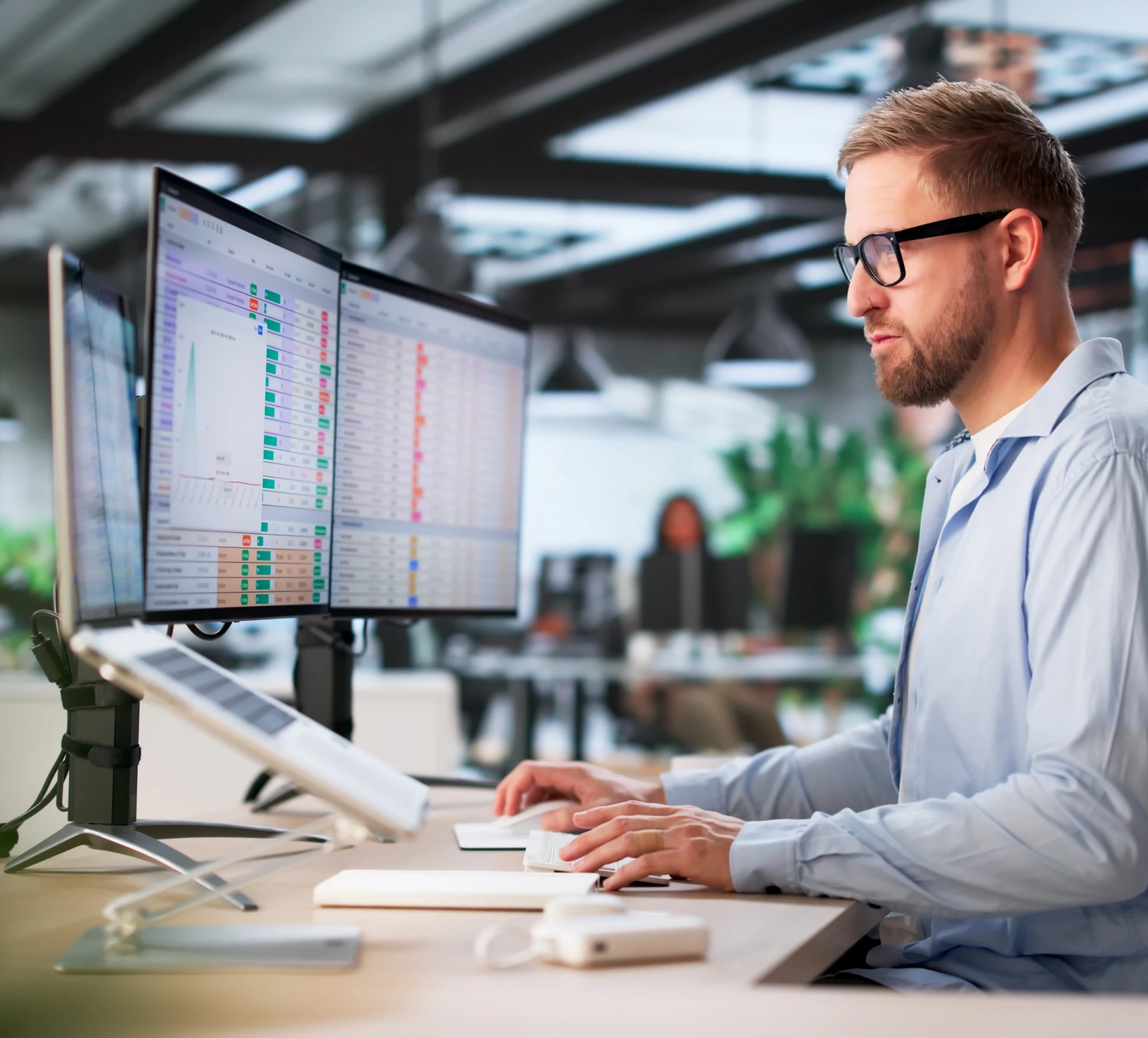 Professional analyzing data on monitors