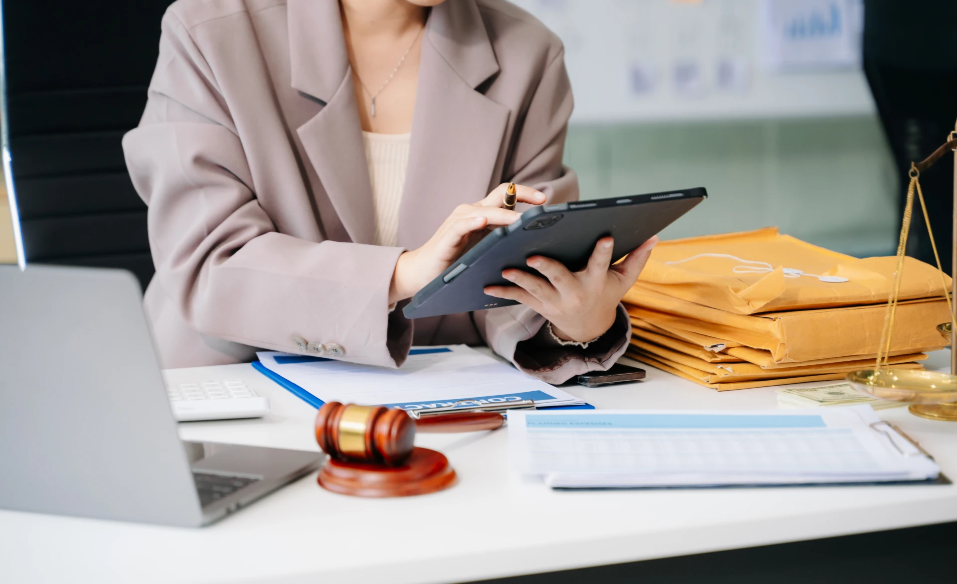 Professional working with documents and tablet