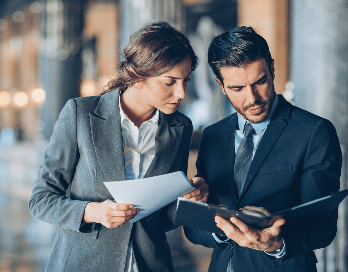 Business professionals reviewing documents together
